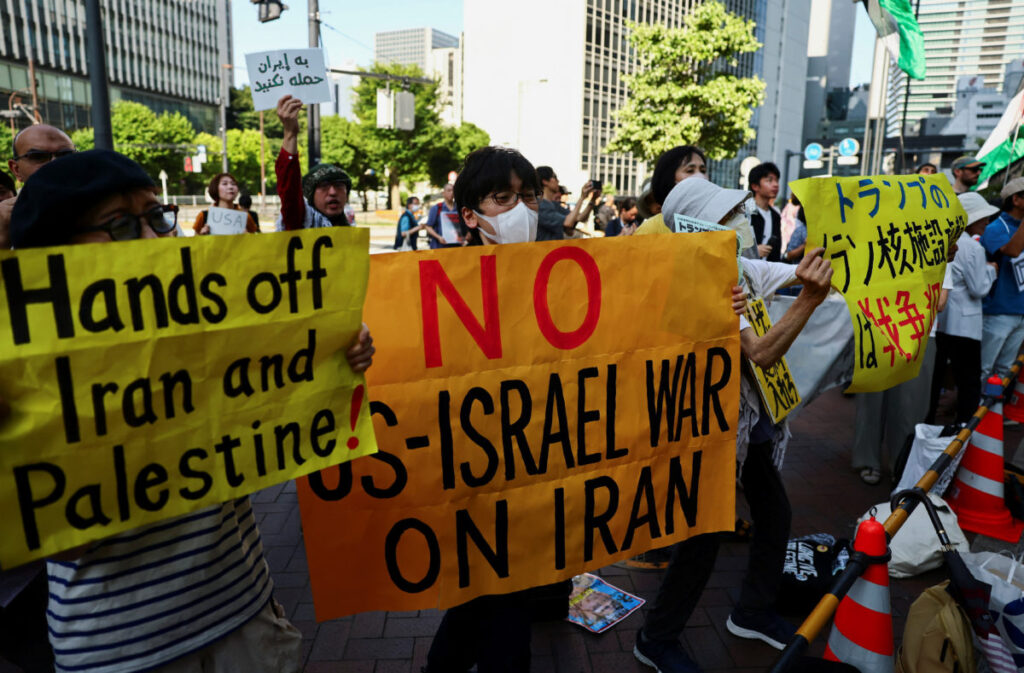 Protesters hold a rally denouncing the U.S. strikes on Iran's nucelar facilities, near the U.S. Embassy in Tokyo, Japan June 22, 2025. REUTERS/Issei Kato