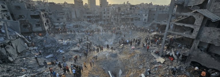 People amid destroyed neighborhood in Gaza